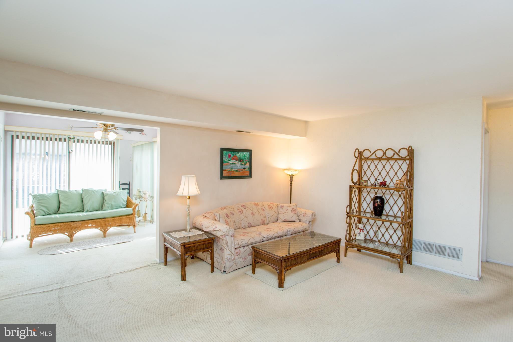 60 B Sumac Court Mount Laurel, NJ 08054 - Photo 9 of 42 a living room with furniture and a gate