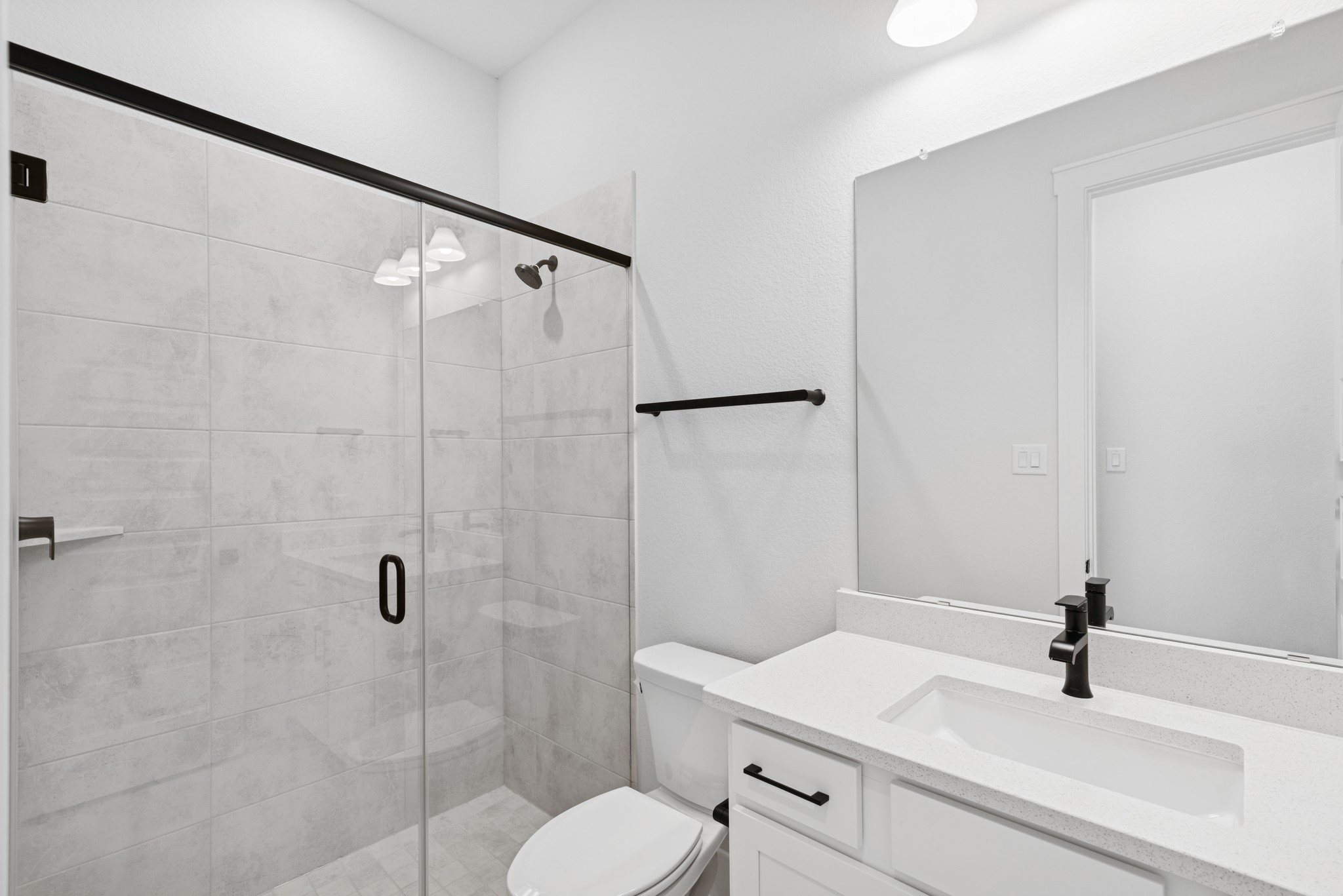 8751 Mancos Valley Porter, TX 77365 - Photo 17 of 48 a bathroom with a sink toilet and shower