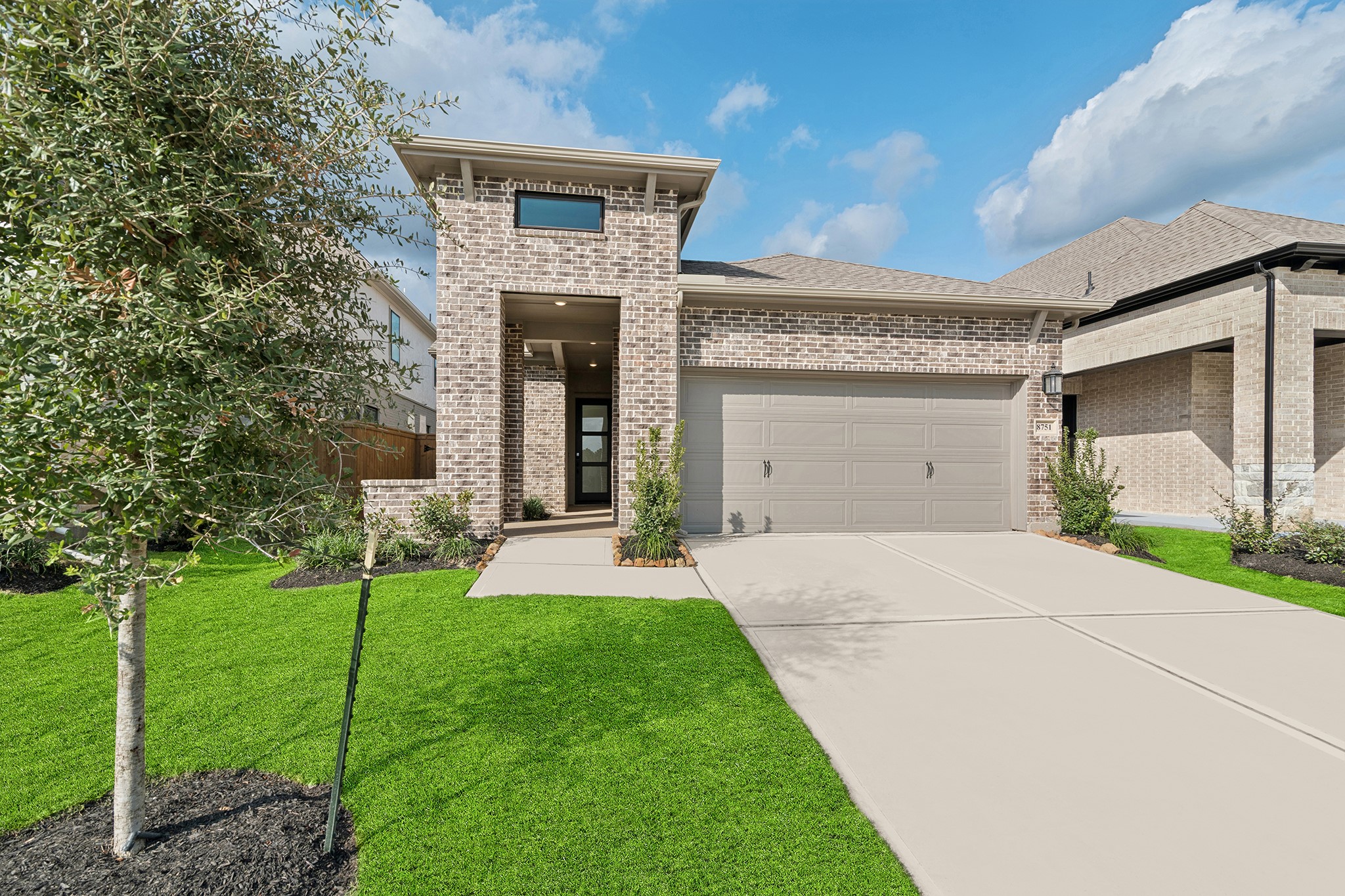 8751 Mancos Valley Porter, TX 77365 - Photo 2 of 48 a front view of a house with a yard and garage