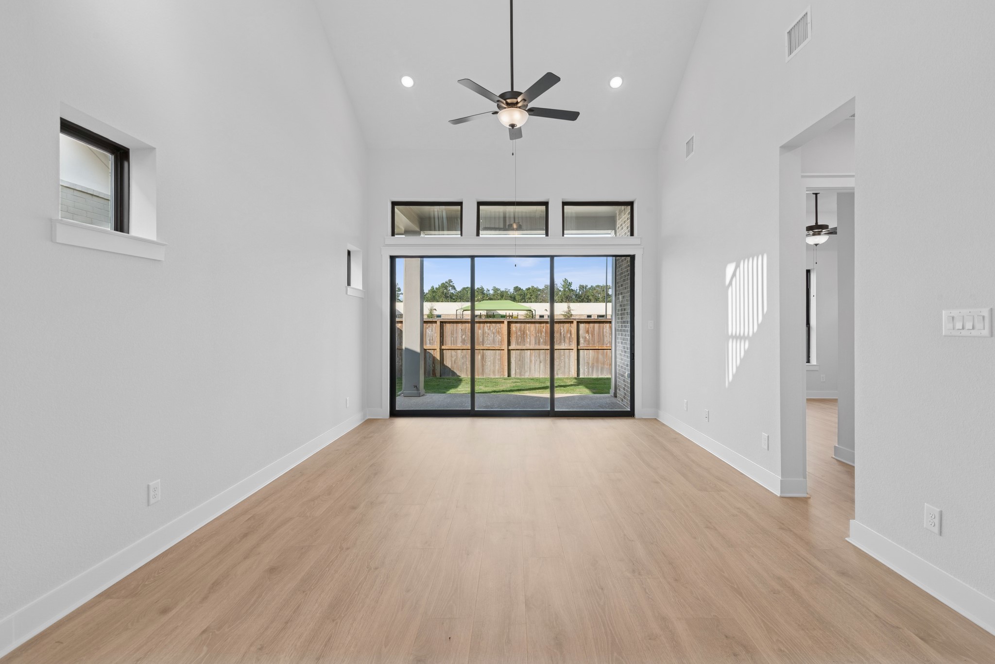 8751 Mancos Valley Porter, TX 77365 - Photo 28 of 48 wooden floor in an empty room with a window