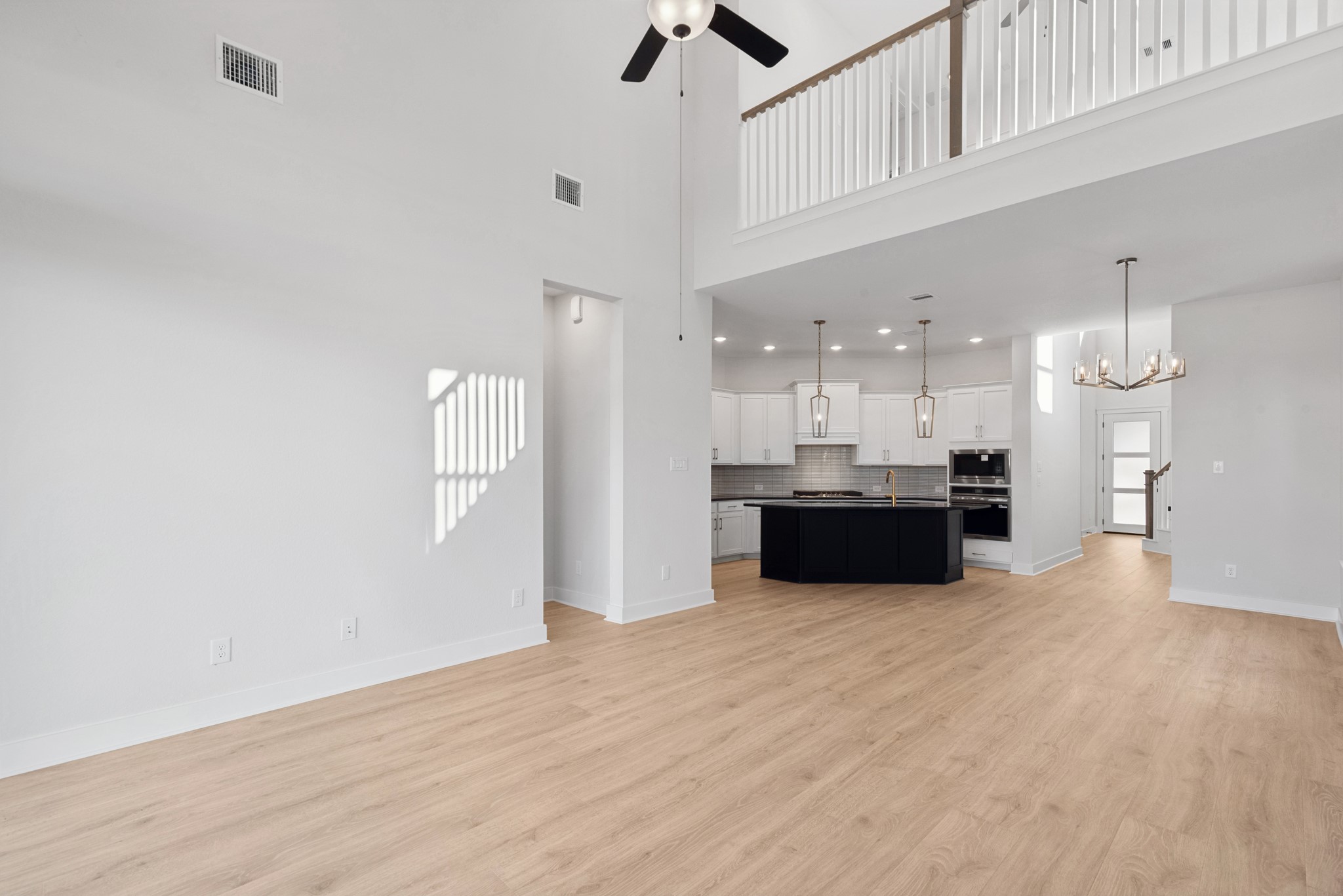 8751 Mancos Valley Porter, TX 77365 - Photo 29 of 48 a view of a kitchen with kitchen island a sink stainless steel appliances and cabinets