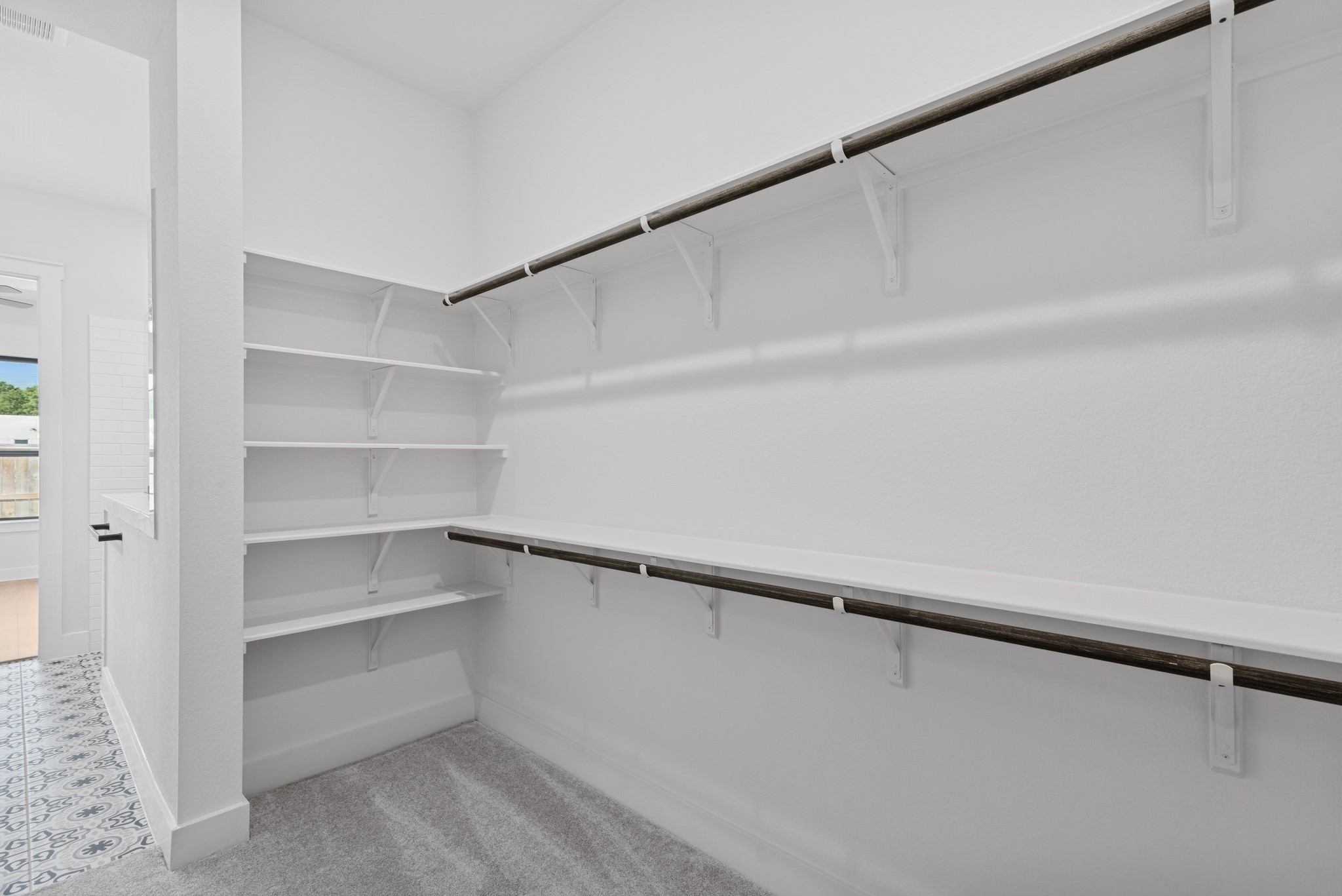 8751 Mancos Valley Porter, TX 77365 - Photo 34 of 48 a view of walk in closet with empty racks