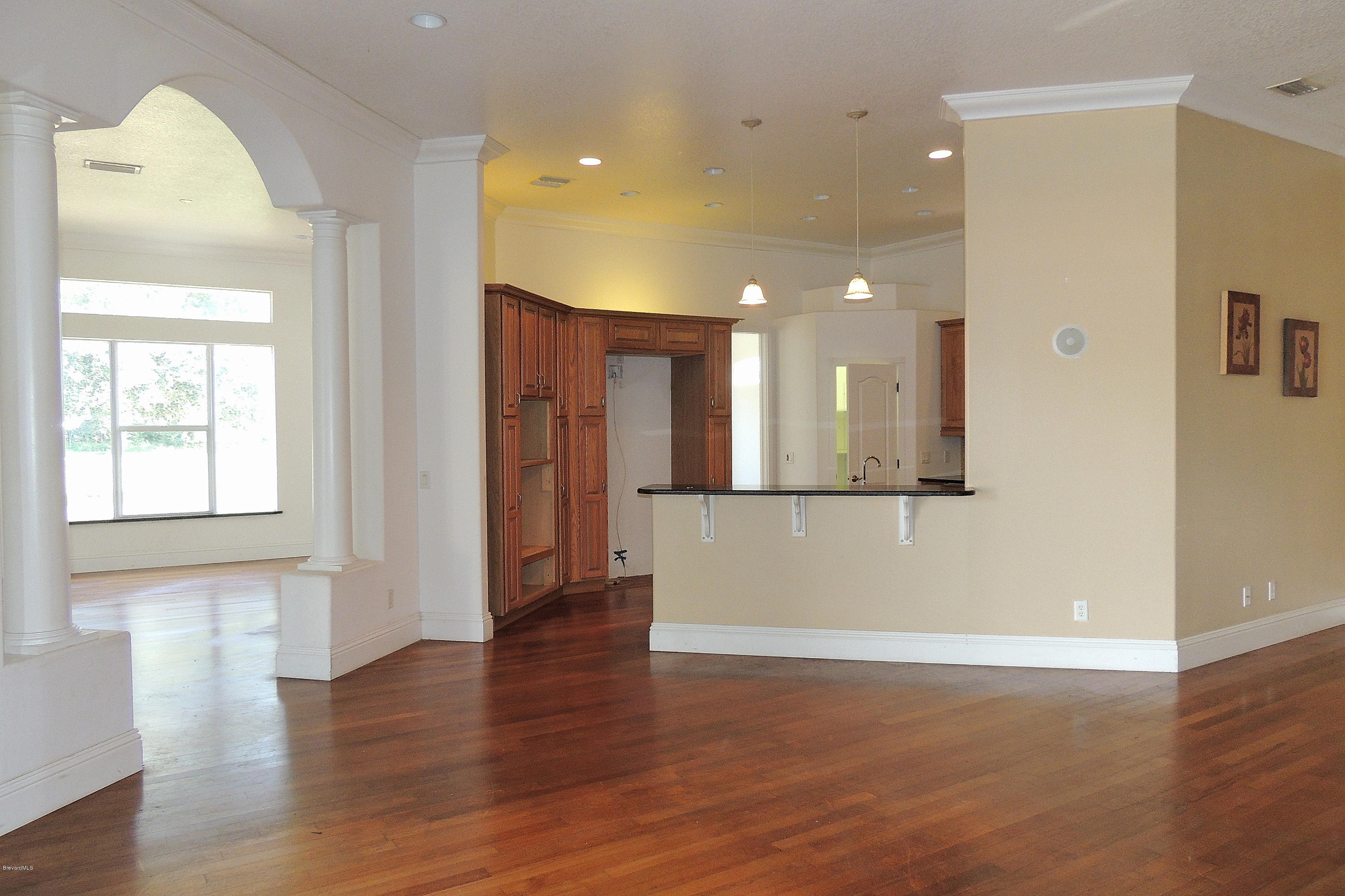 1120 Riviera Drive Northeast Palm Bay, FL 32905 - Photo 3 of 44 a view of a hallway with wooden floor