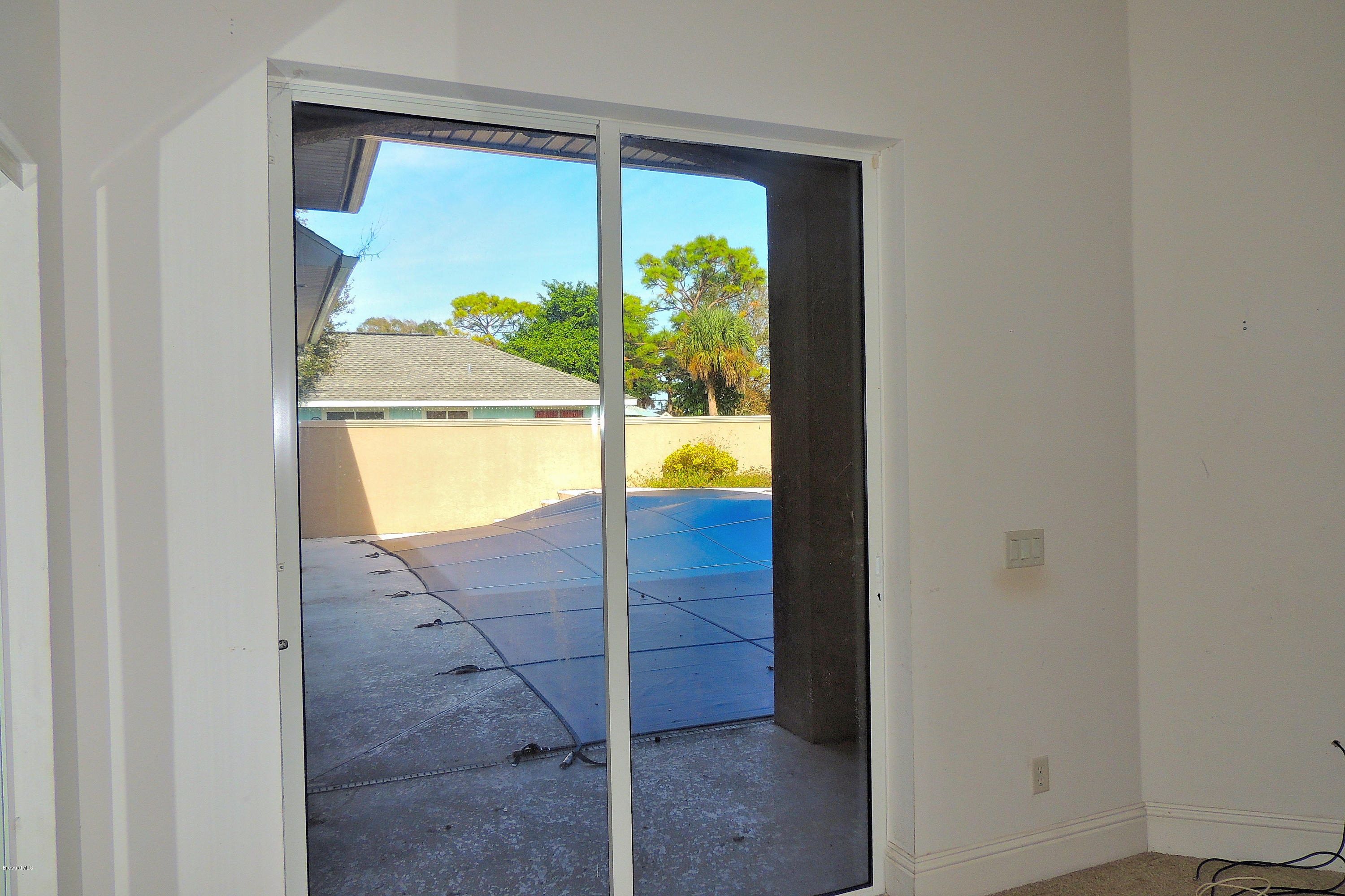1120 Riviera Drive Northeast Palm Bay, FL 32905 - Photo 28 of 44 a view of a glass door with a balcony