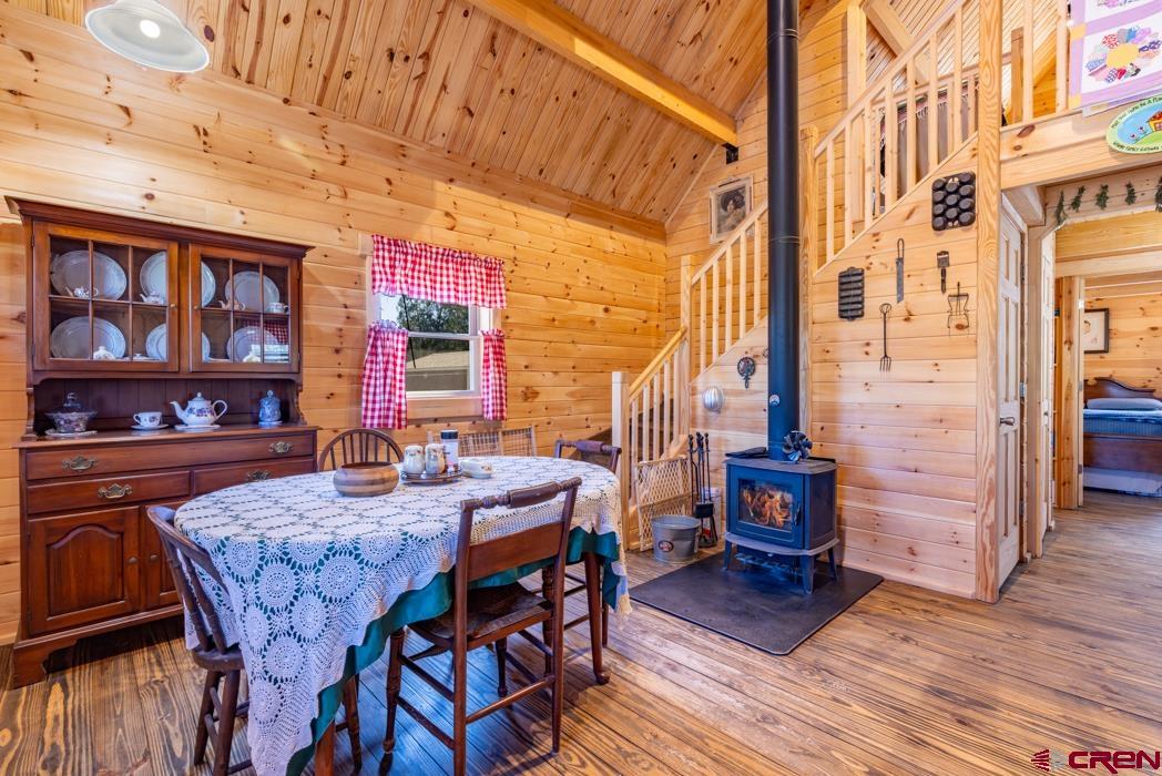 553 Cow Canyon Road Ignacio, CO 81137 - Photo 4 of 34 a view of a dining room with furniture and wooden floor