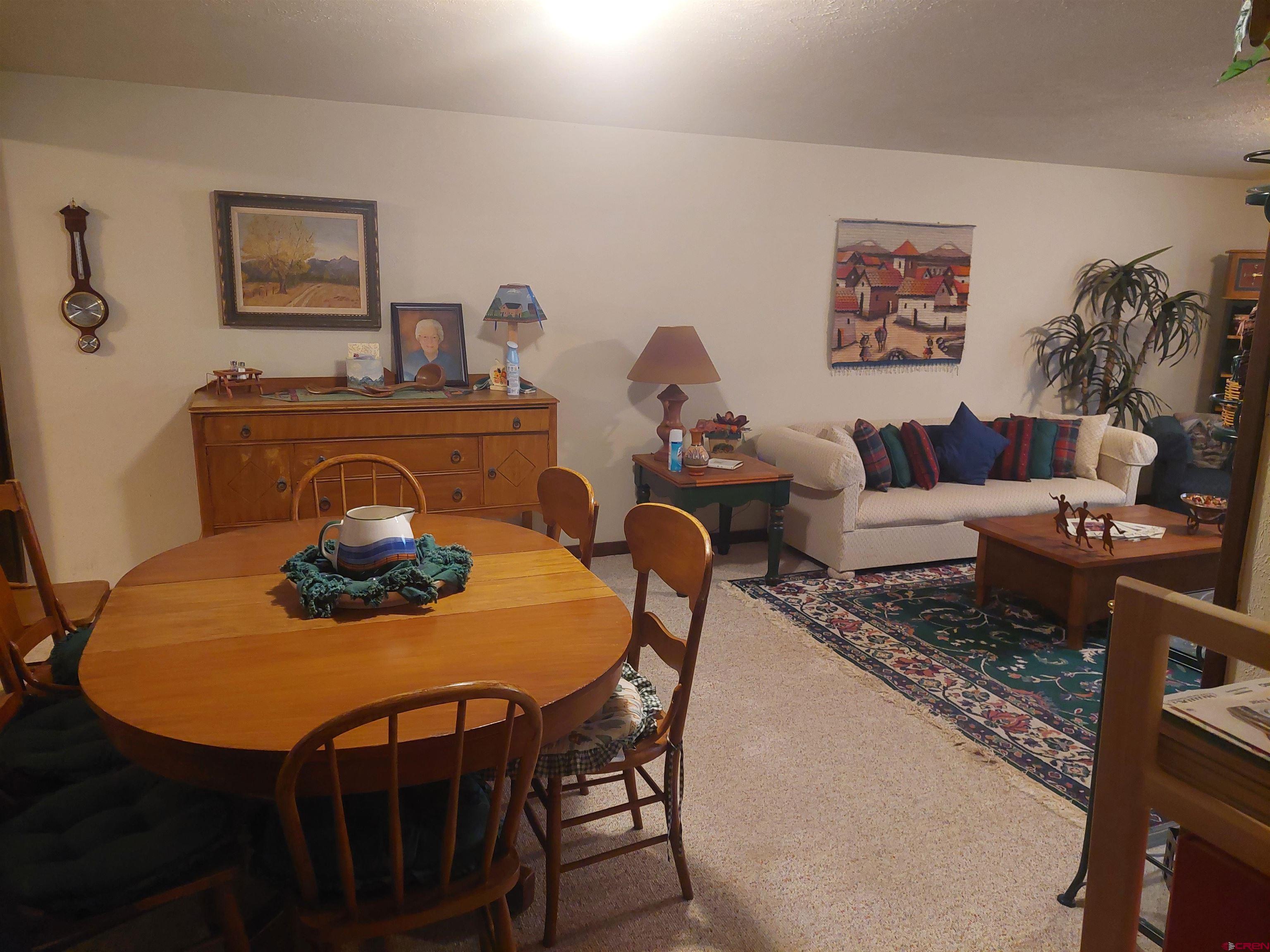 813 Milner Pass Road South Fork, CO 81154 - Photo 13 of 27 a living room with furniture and wooden floor