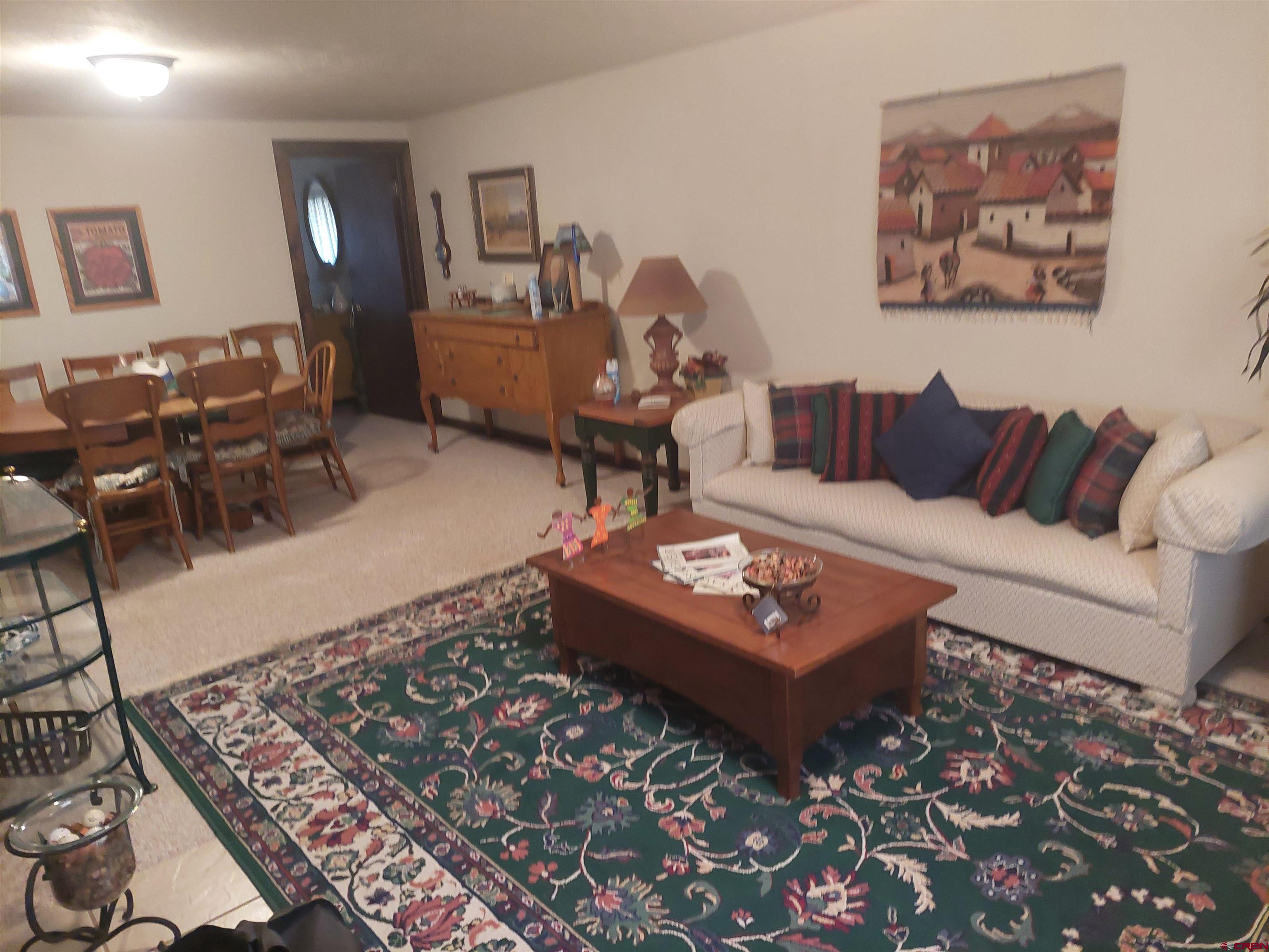 813 Milner Pass Road South Fork, CO 81154 - Photo 15 of 27 a living room with furniture and a rug