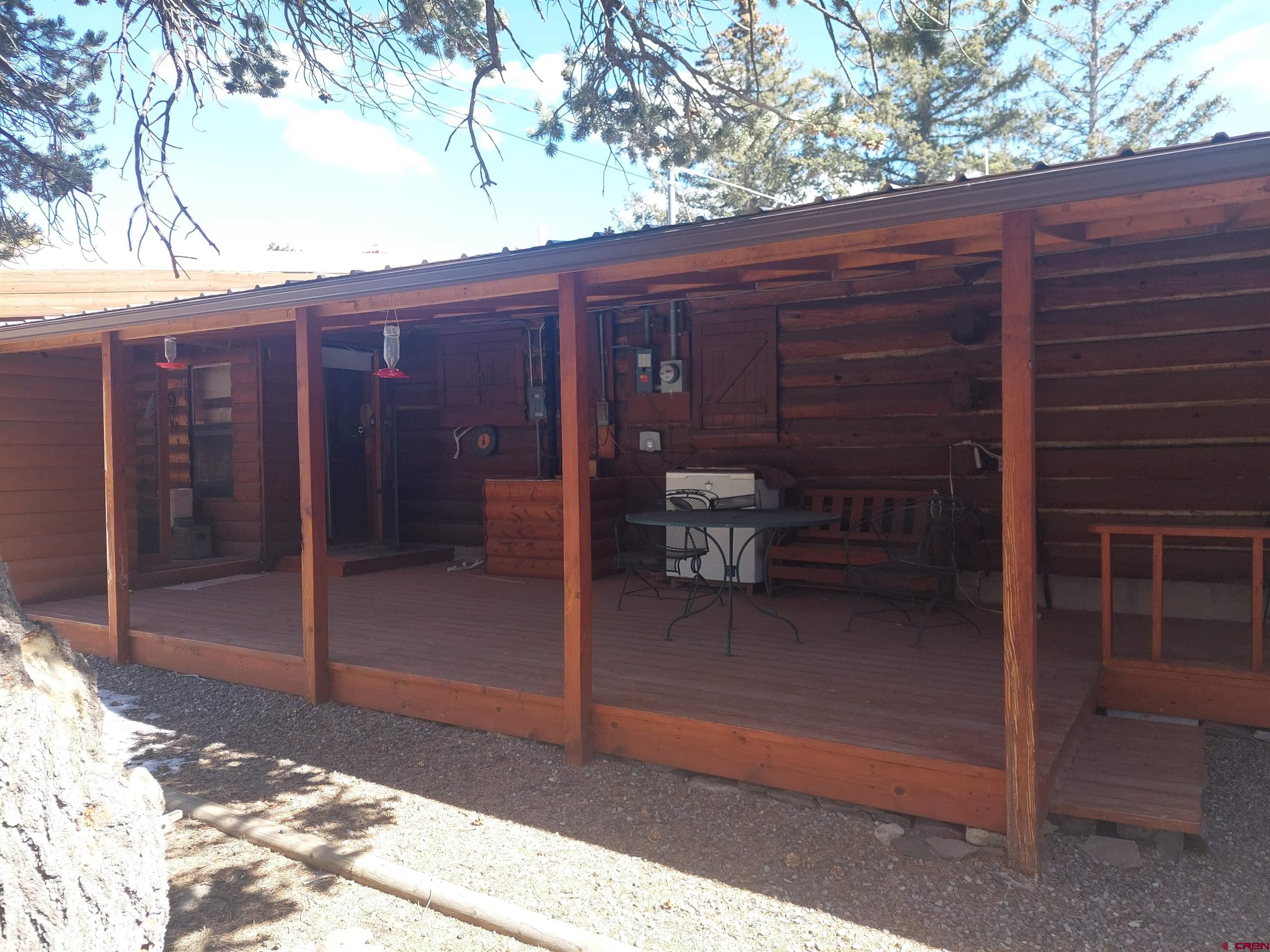 813 Milner Pass Road South Fork, CO 81154 - Photo 21 of 27 a view of a bench in the backyard of a house