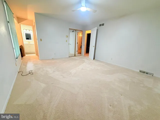 a white toilet sitting next to a bathroom sink