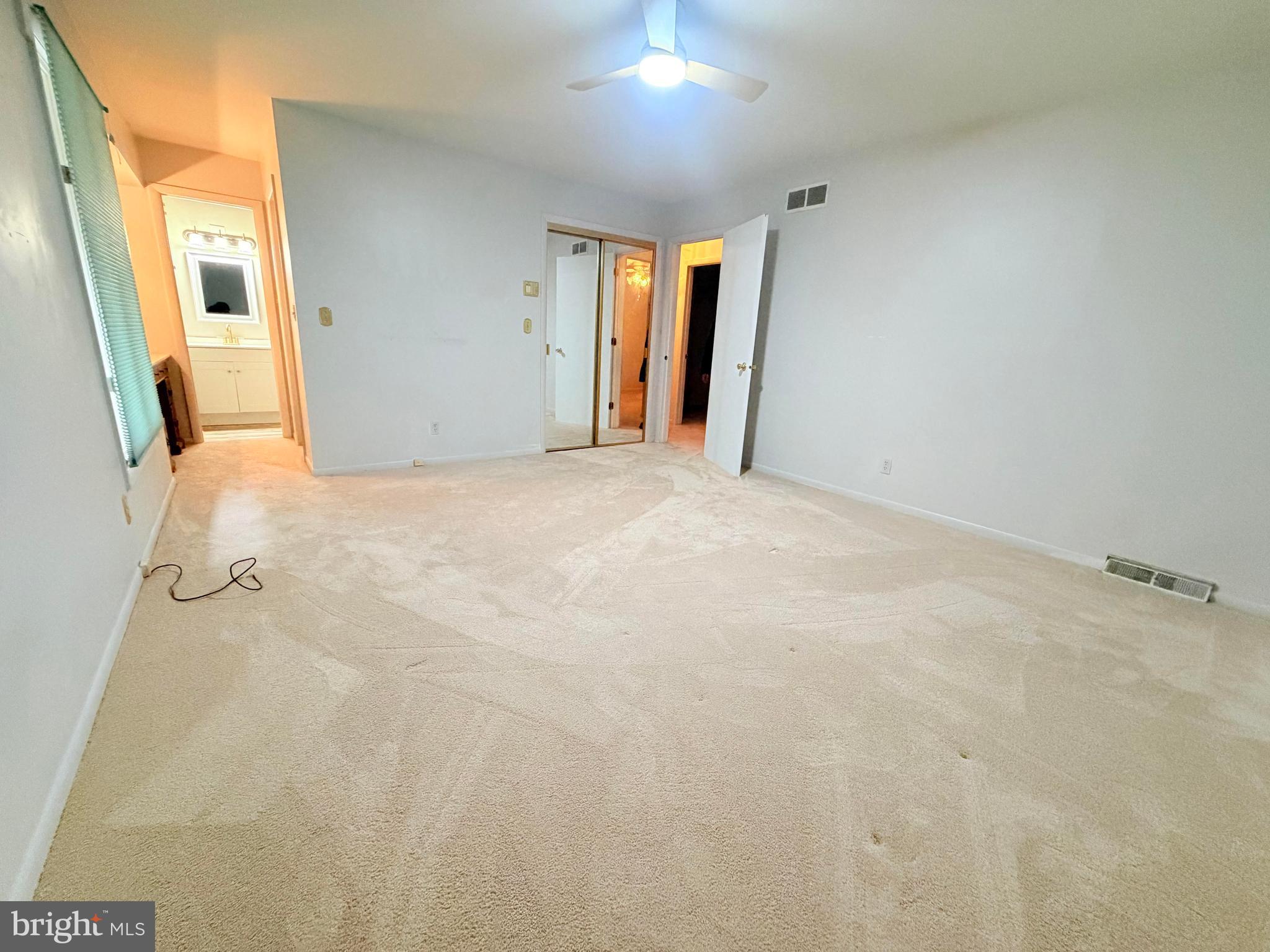 694 Hickory Ridge Road Smyrna, DE 19977 - Photo 12 of 23 a view of a big room with closet and chandelier fan