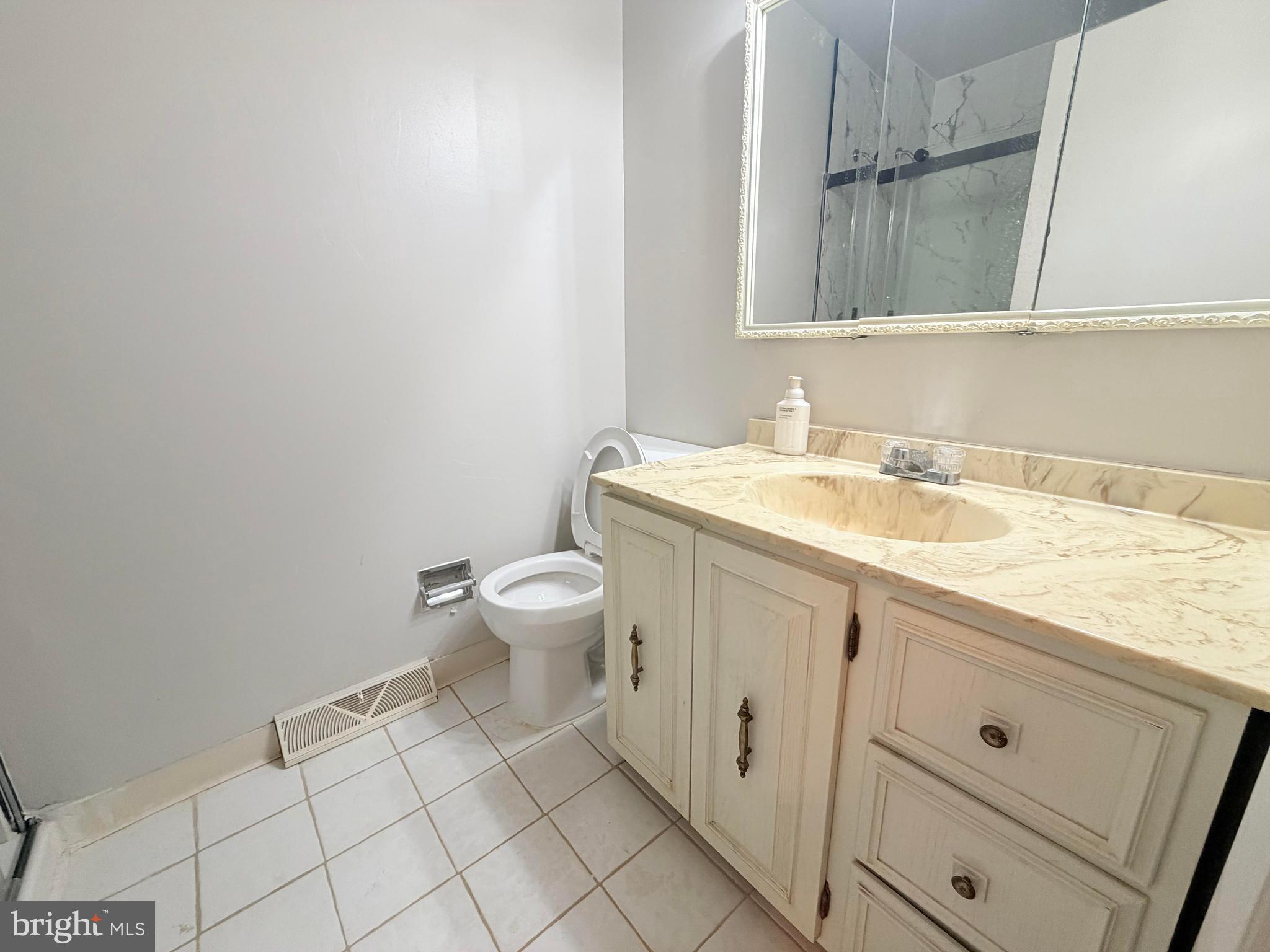 694 Hickory Ridge Road Smyrna, DE 19977 - Photo 16 of 23 a bathroom with a sink and a toilet