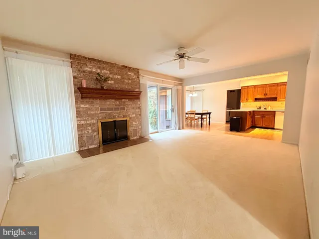 a large bedroom with furniture and a fireplace