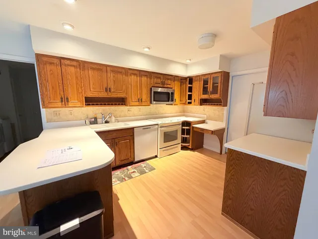 a kitchen with a sink a stove a refrigerator and a stove