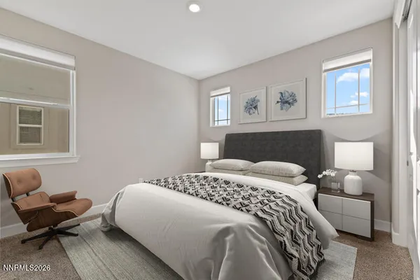 a bedroom with a bed and a couch