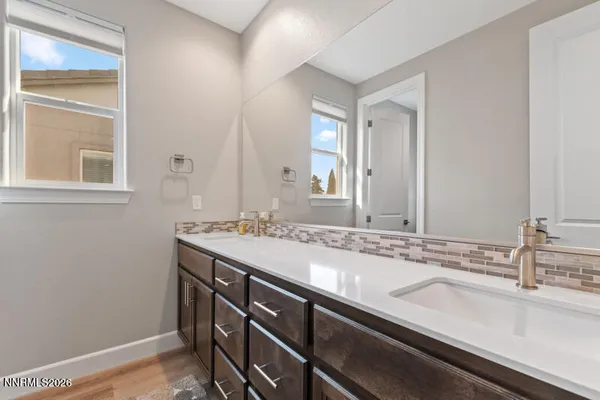 a bathroom with a shower a toilet and sink