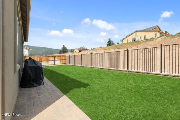 a view of a house with a yard and plants