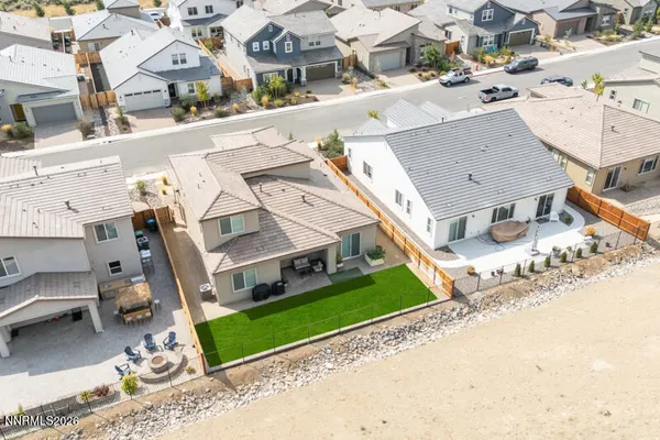 an aerial view of residential houses with outdoor space