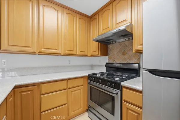 a kitchen with a stove and a microwave