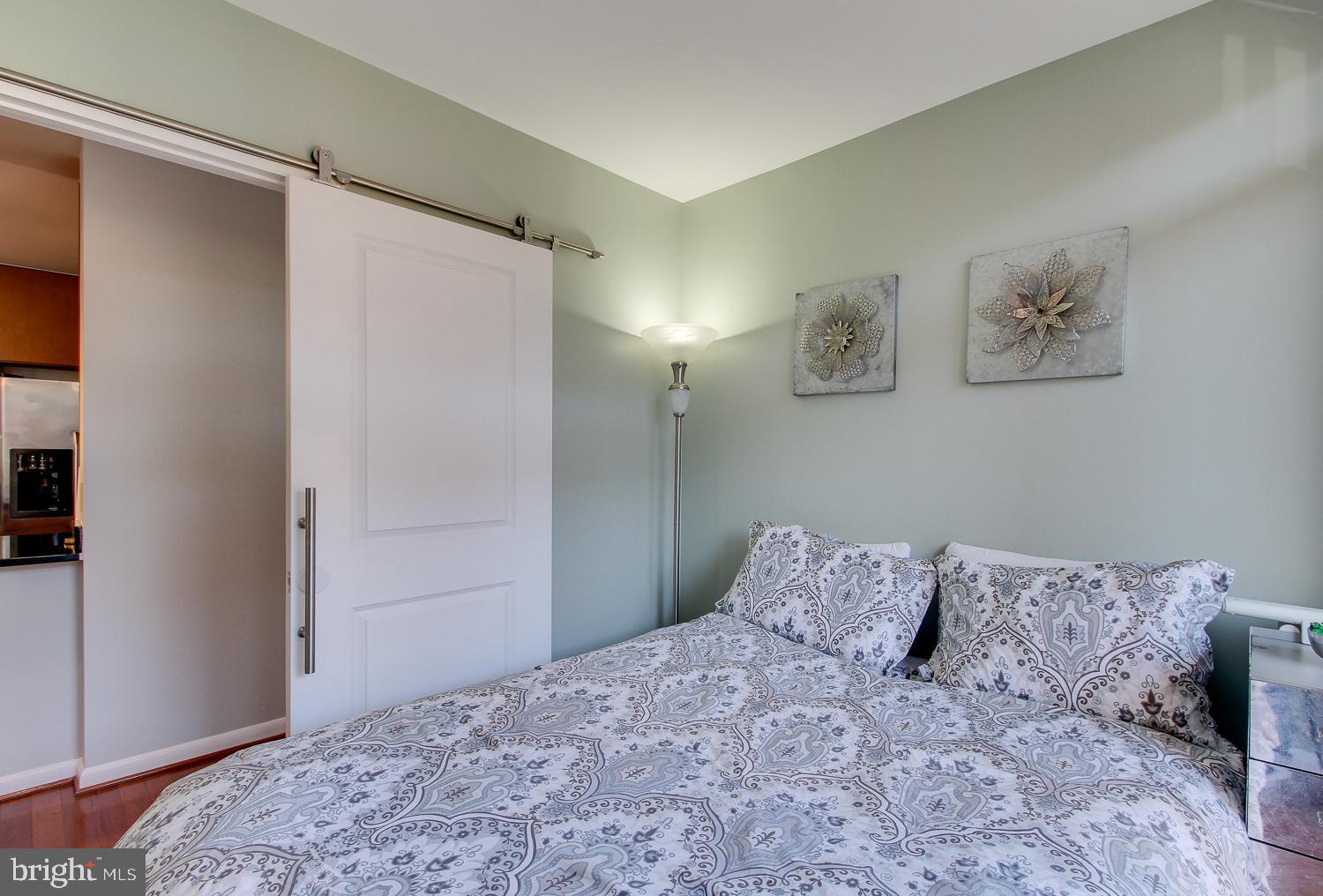 1001 L Street Northwest, Unit 908 Washington, DC 20001 - Photo 17 of 23 2nd Bedroom with sliding barn door