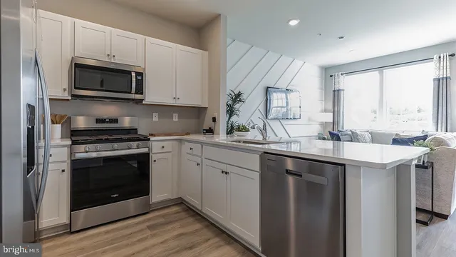 a kitchen with a sink stove and microwave