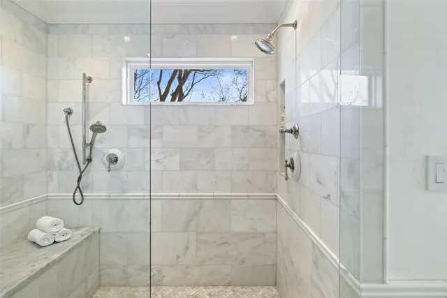 a living room with furniture and painting on the wall