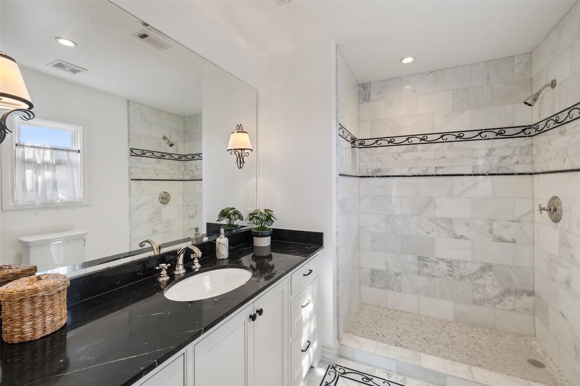 1810 West 35th Street Austin, TX 78703 - Photo 28 of 40 a bathroom with a sink and a mirror