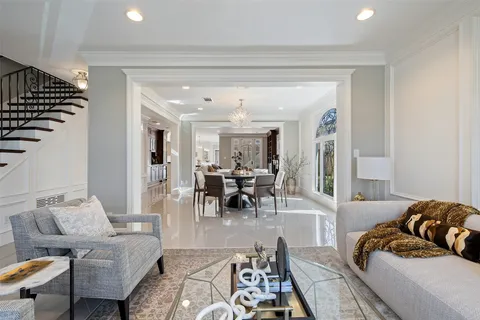 a kitchen with white cabinets and counter space