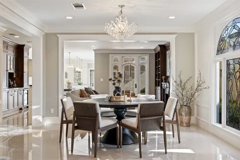 a spacious bedroom with a bed and wooden floor