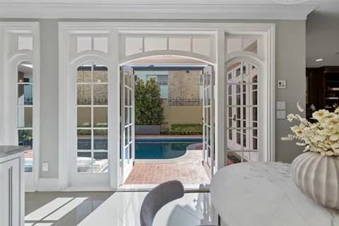 a spacious bathroom with a tub sink and mirror
