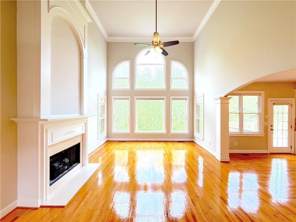 3500 Millwater Crossing Northeast Dacula, GA 30019 - Photo 16 of 72 a view of an empty room with a fireplace and a window