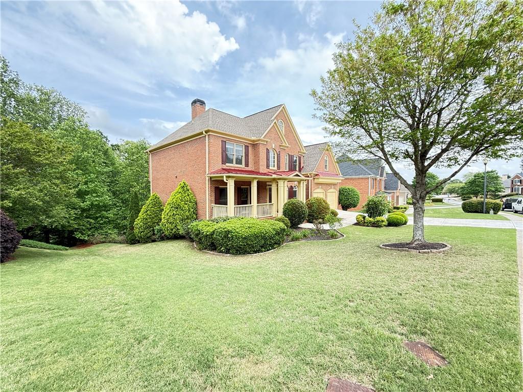 3500 Millwater Crossing Northeast Dacula, GA 30019 - Photo 2 of 72 a front view of a house with a yard