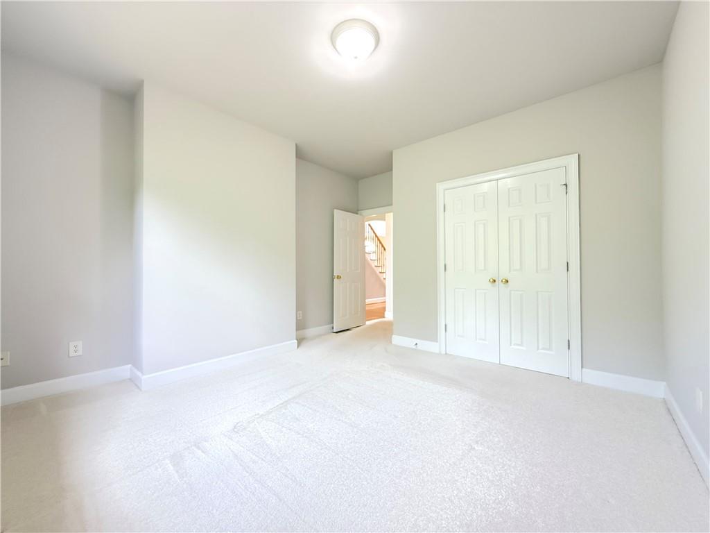3500 Millwater Crossing Northeast Dacula, GA 30019 - Photo 33 of 72 an empty room with windows and bathroom view