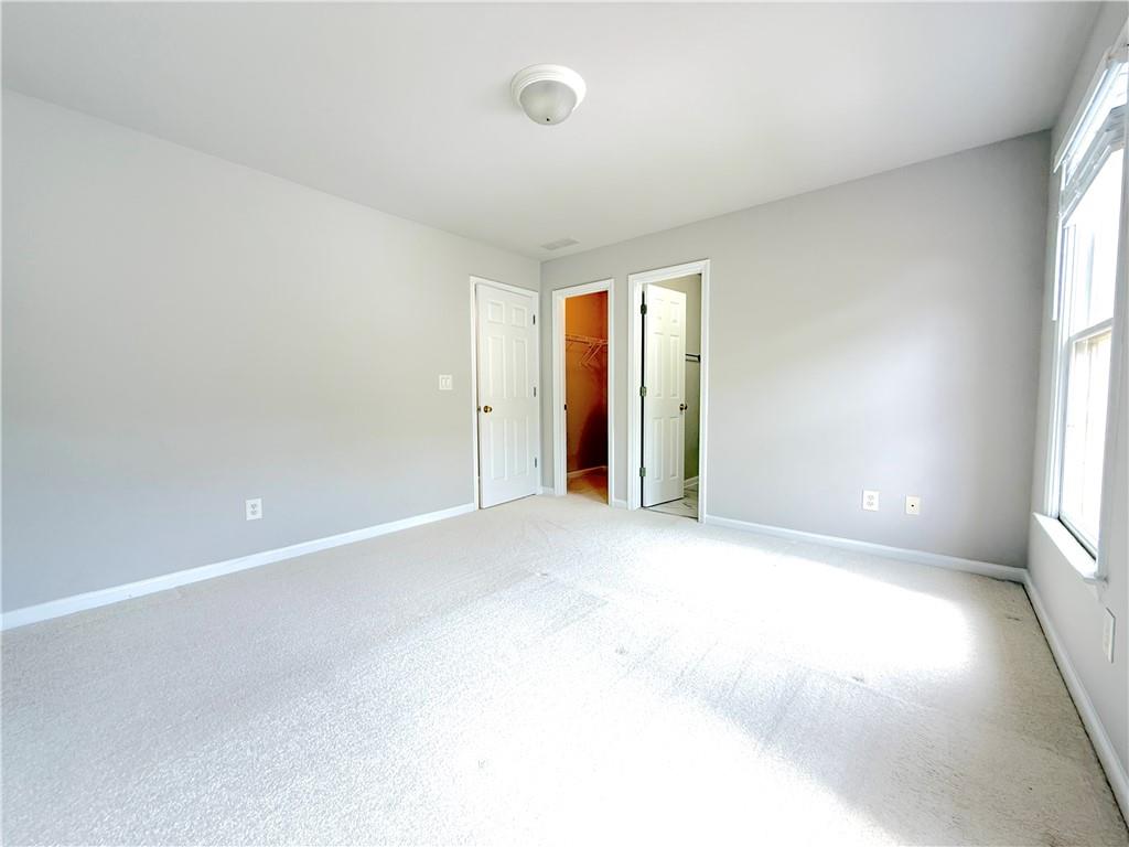 3500 Millwater Crossing Northeast Dacula, GA 30019 - Photo 41 of 72 an empty room with windows and closet