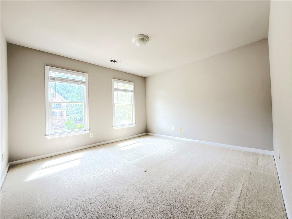 3500 Millwater Crossing Northeast Dacula, GA 30019 - Photo 42 of 72 an empty room with windows