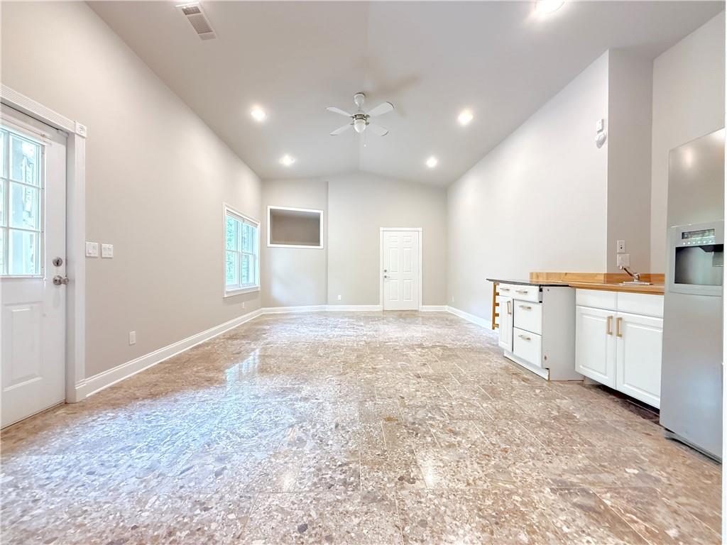 3500 Millwater Crossing Northeast Dacula, GA 30019 - Photo 57 of 72 a view of a kitchen with center island and stainless steel appliances