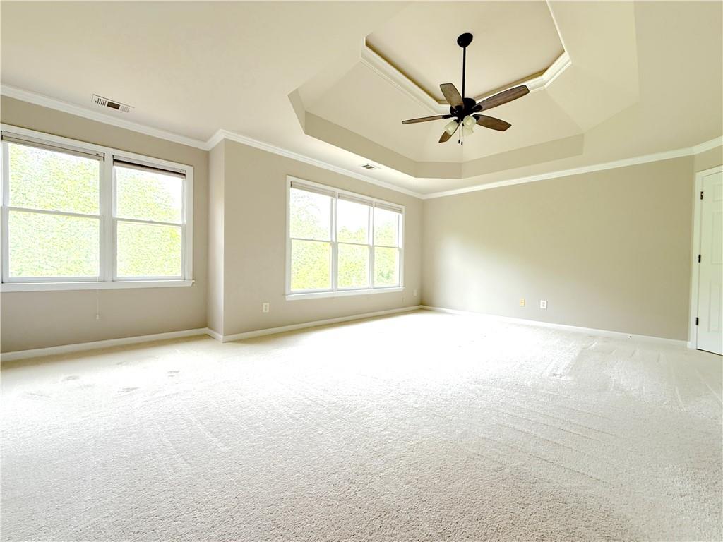 3500 Millwater Crossing Northeast Dacula, GA 30019 - Photo 61 of 72 an empty room with windows and fan