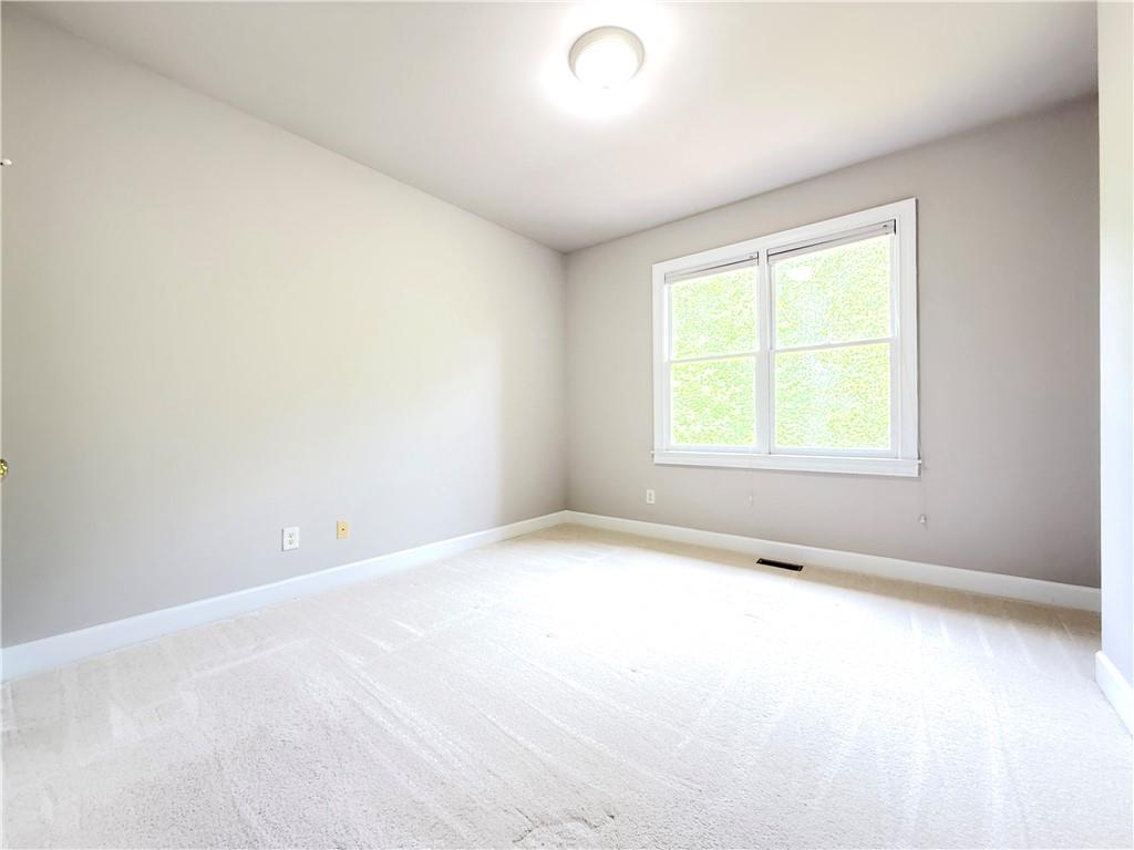 3500 Millwater Crossing Northeast Dacula, GA 30019 - Photo 62 of 72 an empty room with a window