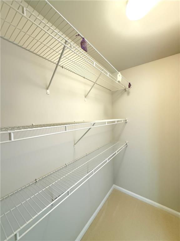 3500 Millwater Crossing Northeast Dacula, GA 30019 - Photo 63 of 72 a view of a room with racks on the wall