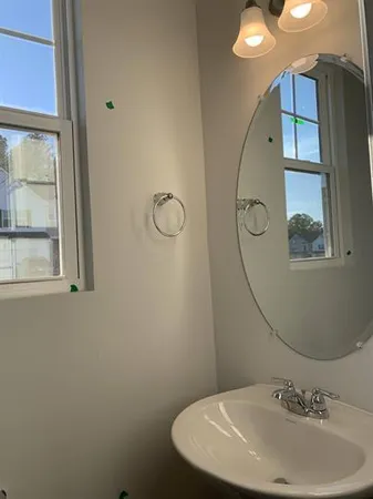a bathroom with a sink and mirror