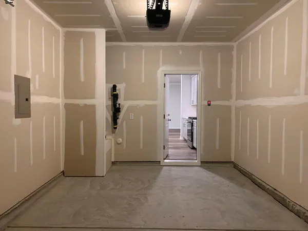 a view of a hallway with wooden shelves