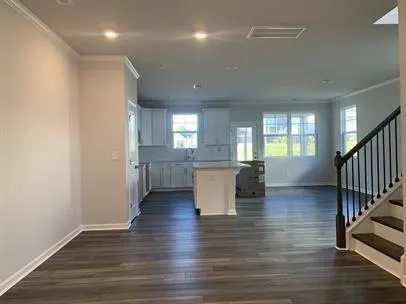 a view of kitchen and dining room with wooden floor
