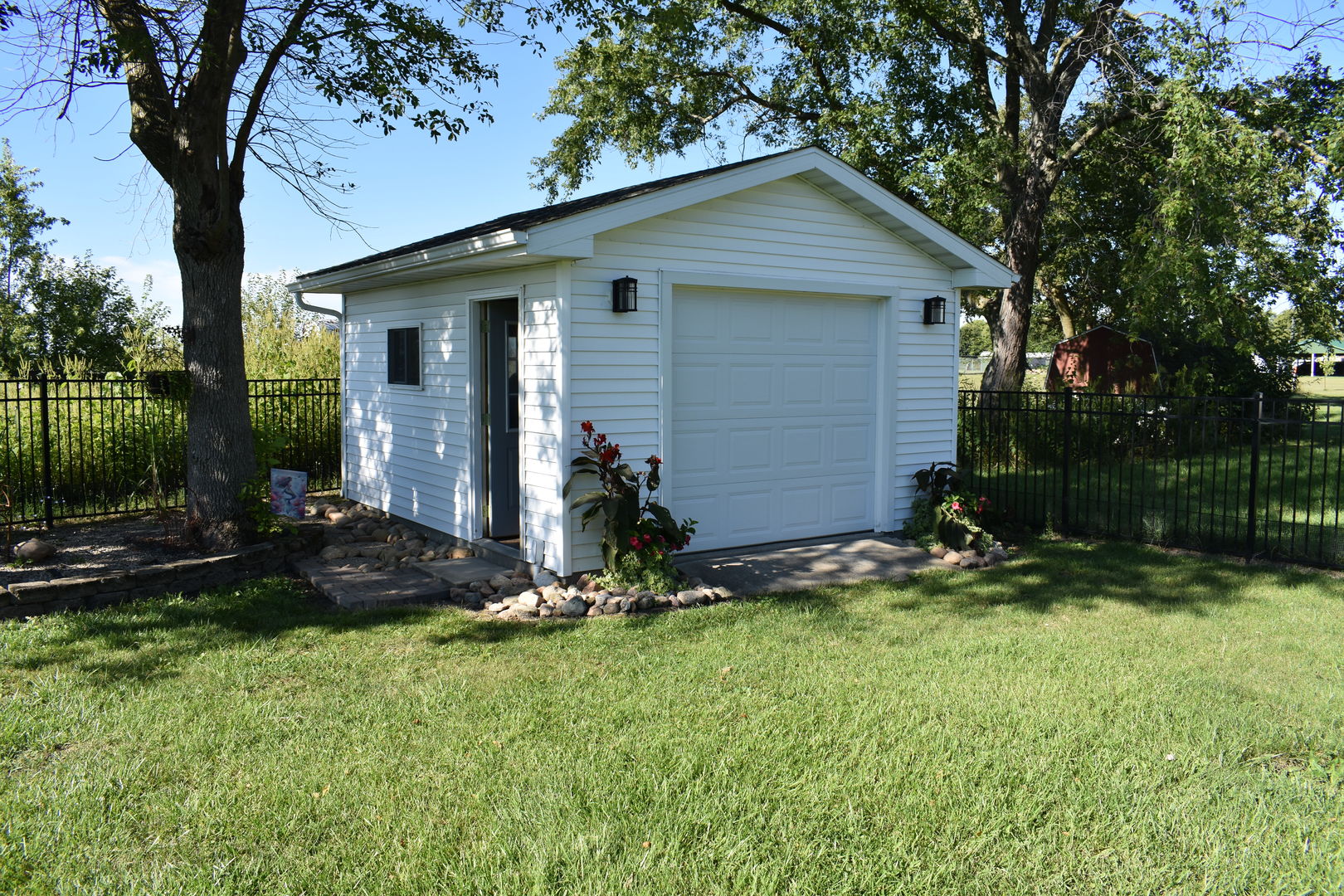 403 East Elm Street Buckley, IL 60918 - Photo 17 of 20 a view of a backyard with plants and a large tree