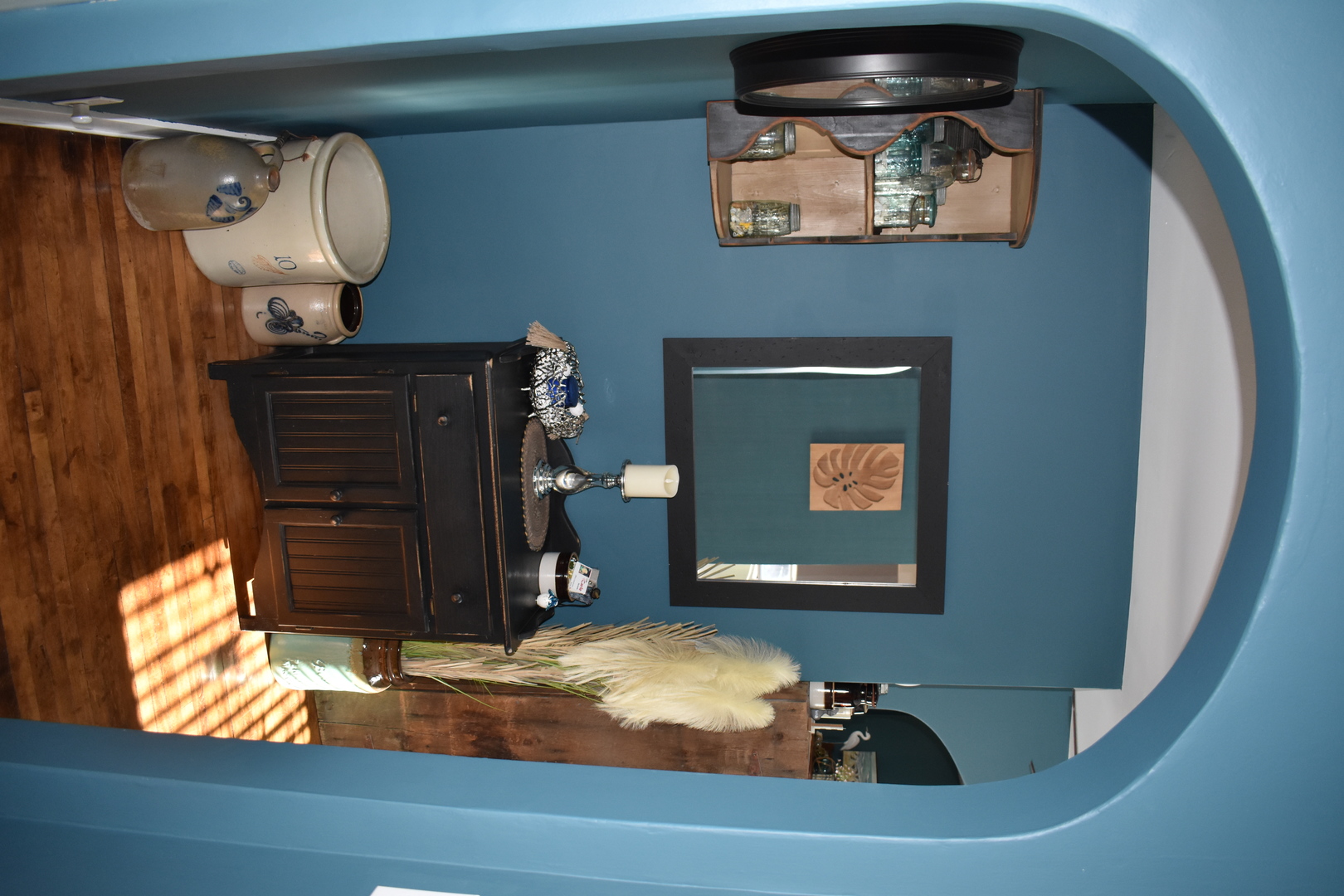 403 East Elm Street Buckley, IL 60918 - Photo 10 of 20 a room with a mirror and a lamp