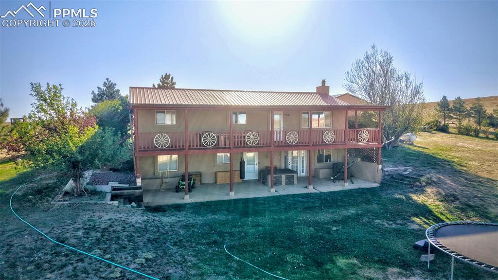 18560 Chelton Road Ramah, CO 80832 - Photo 28 of 34 a view of a house with a yard