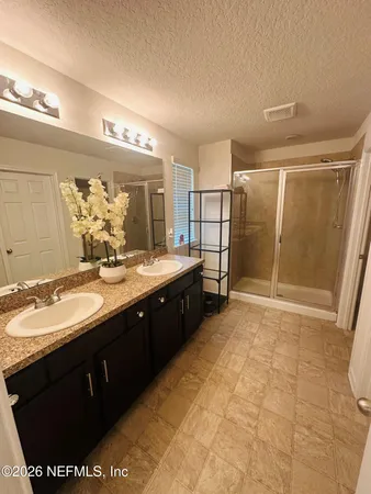 a bathroom with a sink a toilet and vanity