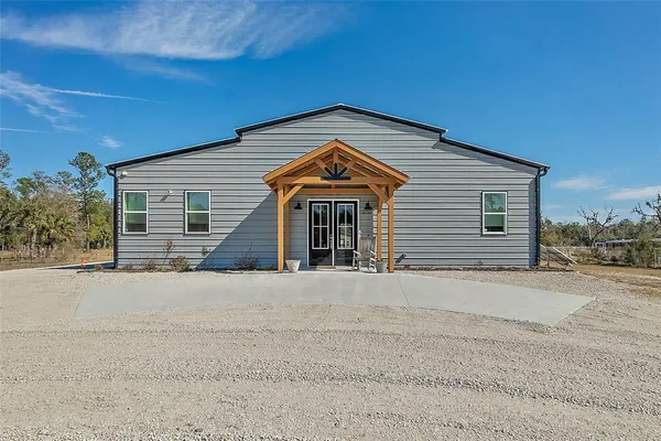 front view of a house with a road