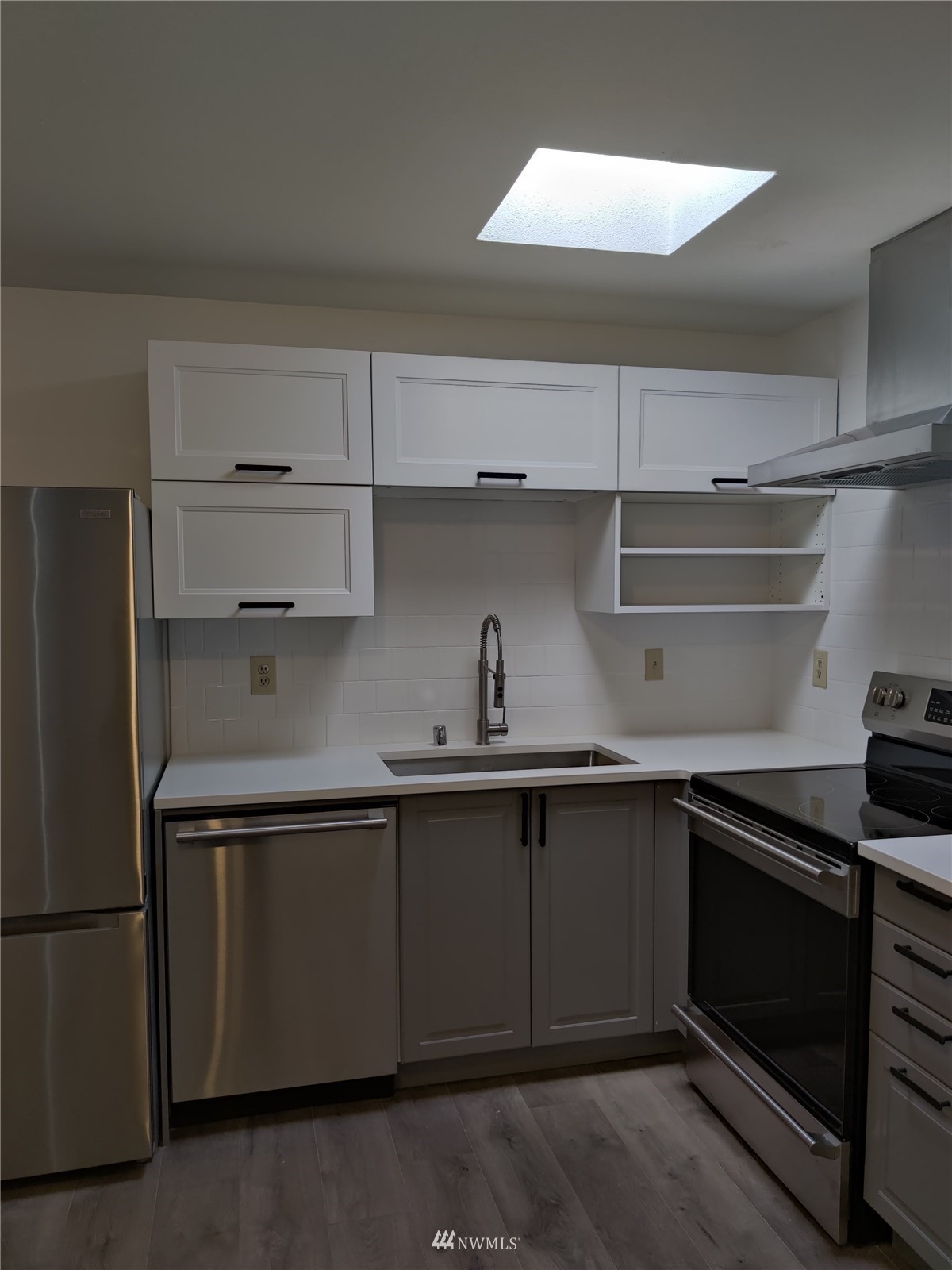 4308 Northeast Sunset Boulevard, Unit Z2 Renton, WA 98059 - Photo 4 of 6 a kitchen with a sink and cabinets