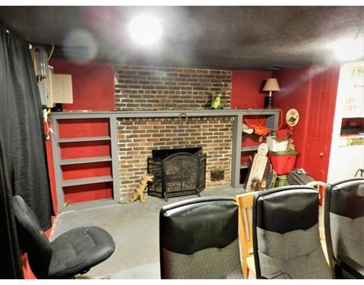 1291 Plumtree Road Springfield, MA 01119 - Photo 20 of 30 a living room with furniture and a fireplace