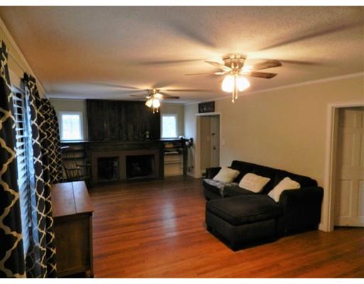 1291 Plumtree Road Springfield, MA 01119 - Photo 5 of 30 a living room with furniture and a fireplace
