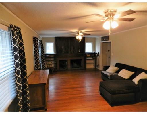 1291 Plumtree Road Springfield, MA 01119 - Photo 6 of 30 a living room with furniture and a fireplace